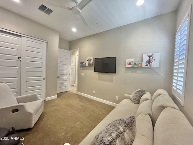 living room featuring recessed lighting, carpet flooring, a ceiling fan, visible vents, and baseboards