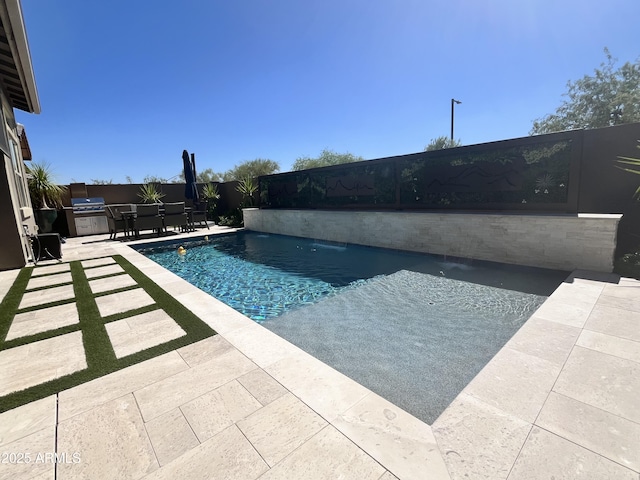 view of swimming pool with a fenced in pool, a patio, a fenced backyard, a grill, and outdoor dining area