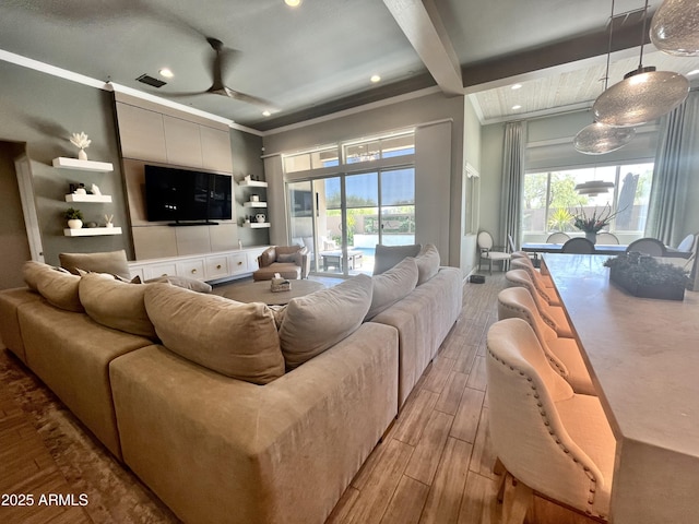 living area with wood finish floors, recessed lighting, visible vents, a ceiling fan, and beamed ceiling