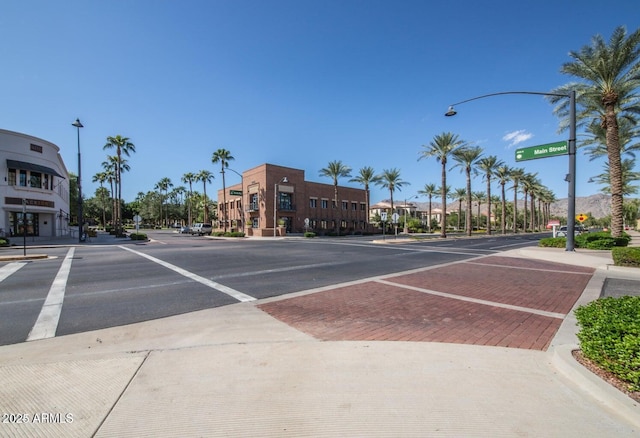 20546 W Summit Pl, Buckeye, AZ 85396 - view of asphalt street featuring street lighting, sidewalks, and curbs