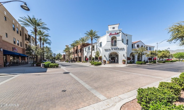 20546 W Summit Pl, Buckeye, AZ 85396 - view of decorative street with street lights, curbs, and sidewalks