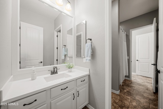 20546 W Summit Pl, Buckeye, AZ 85396 - full bath with baseboards, vanity, stone finish flooring, and a shower with curtain