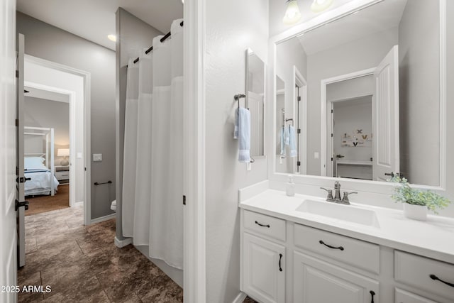 20546 W Summit Pl, Buckeye, AZ 85396 - bathroom with vanity, toilet, ensuite bath, a shower with shower curtain, and baseboards