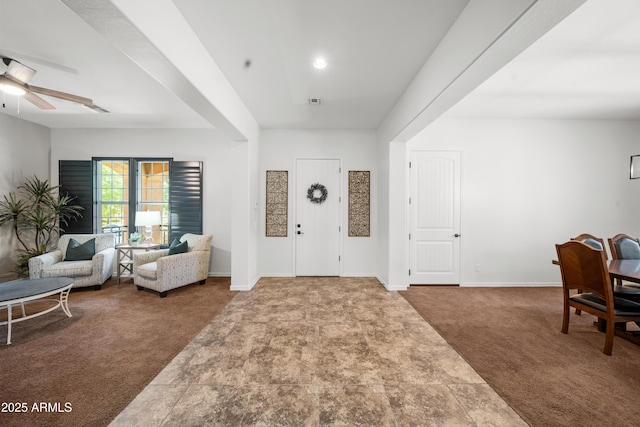 20546 W Summit Pl, Buckeye, AZ 85396 - entryway featuring carpet flooring, ceiling fan, and baseboards