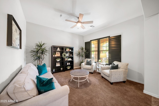 20546 W Summit Pl, Buckeye, AZ 85396 - living room with ceiling fan, carpet, and baseboards