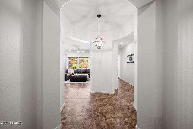 20546 W Summit Pl, Buckeye, AZ 85396 - corridor featuring a chandelier and baseboards