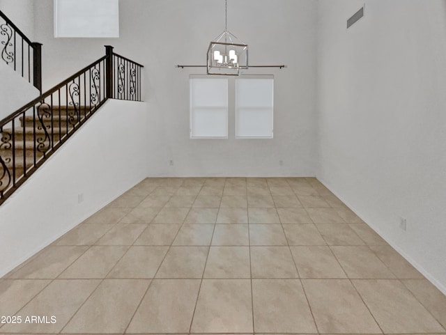 interior space featuring a chandelier and light tile patterned floors