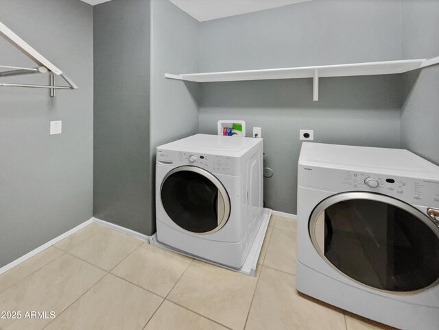 laundry room featuring independent washer and dryer and tile patterned floors