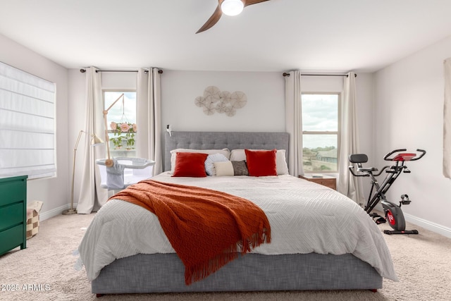 bedroom featuring ceiling fan, carpet, and baseboards