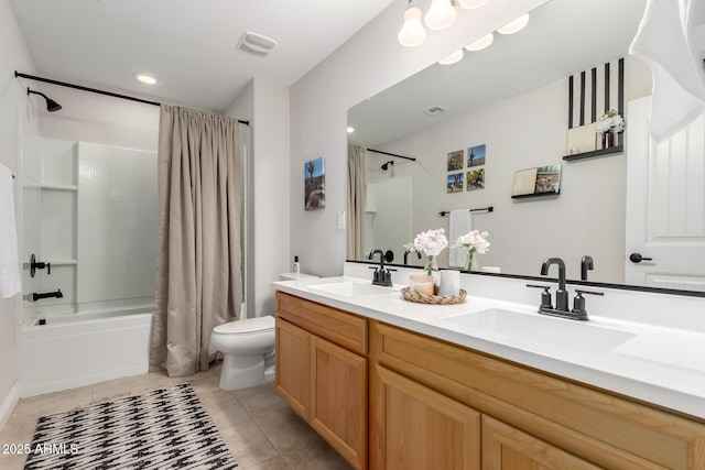 full bathroom featuring tile patterned flooring, a sink, toilet, and shower / bathtub combination with curtain