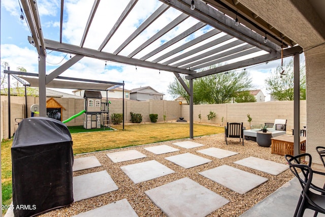 view of patio / terrace with a fenced backyard, a grill, and a playground