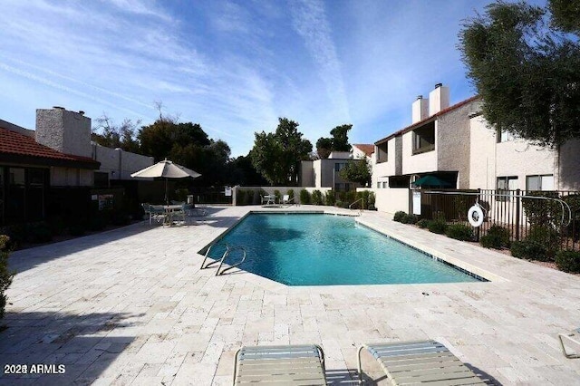 view of swimming pool featuring a patio