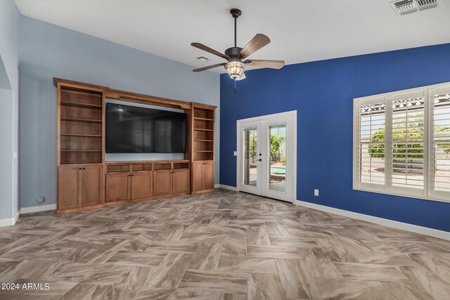 foyer featuring lofted ceiling, a notable chandelier, and light parquet flooring