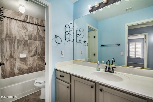 bathroom featuring visible vents, shower / bathtub combination, vanity, and toilet