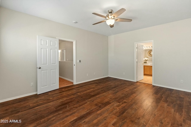 unfurnished bedroom featuring ceiling fan, dark hardwood / wood-style floors, and ensuite bath