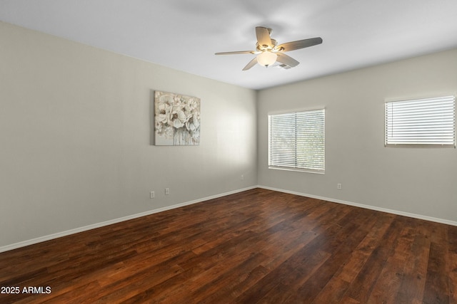 unfurnished room featuring dark hardwood / wood-style floors and ceiling fan