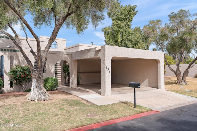 view of front of property with concrete driveway and stucco siding