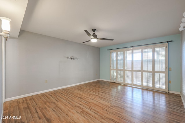 unfurnished room with ceiling fan and light wood-type flooring