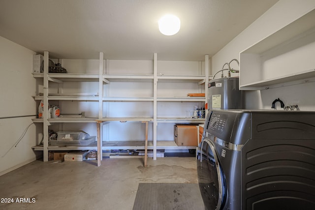 storage featuring water heater and washer / clothes dryer