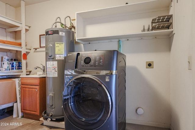 laundry area featuring washer / clothes dryer, sink, electric water heater, and cabinets