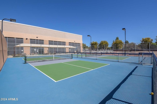 view of tennis court with basketball court