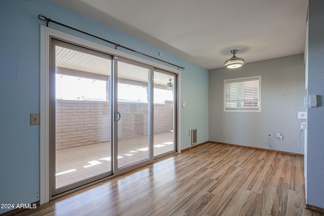 interior space featuring light hardwood / wood-style flooring and a wealth of natural light