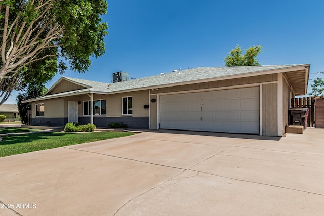 8315 E Vernon Ave, Scottsdale, AZ 85257 - ranch-style home with an attached garage, concrete driveway, roof with shingles, and brick siding