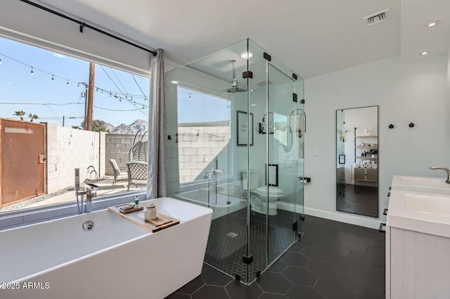 full bathroom with vanity, toilet, independent shower and bath, and tile patterned flooring