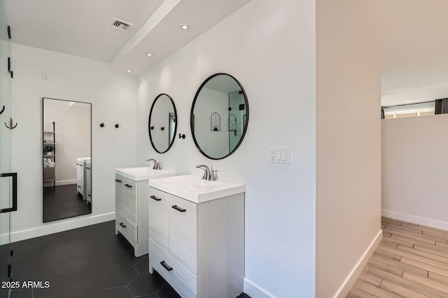 bathroom featuring vanity and wood-type flooring