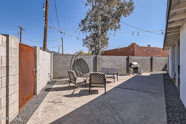 view of patio featuring a grill