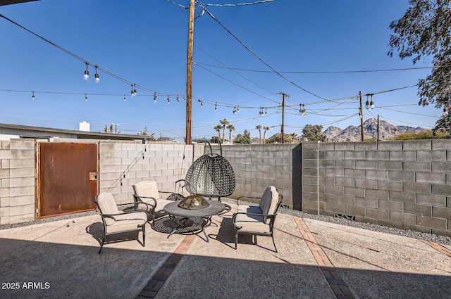 view of patio / terrace featuring an outdoor fire pit