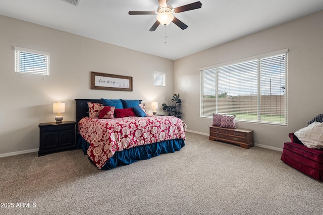 bedroom with ceiling fan, baseboards, and carpet flooring