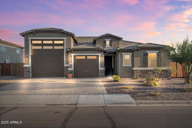 prairie-style home featuring a garage