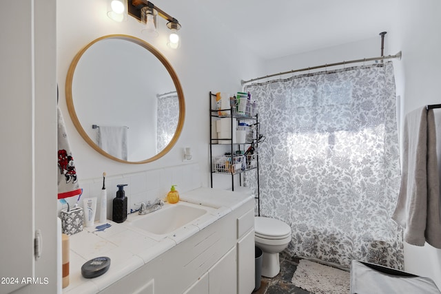 bathroom featuring vanity, toilet, and a shower with curtain