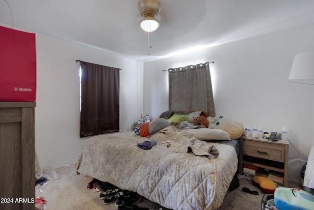 carpeted bedroom featuring ceiling fan