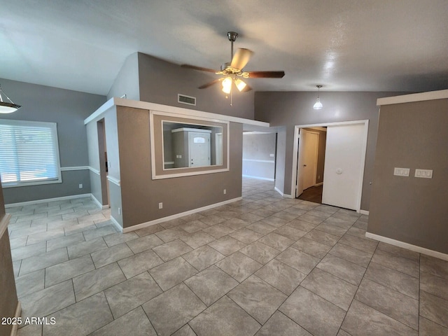 tiled spare room with ceiling fan and lofted ceiling