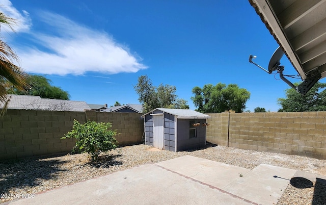 view of patio with a storage shed