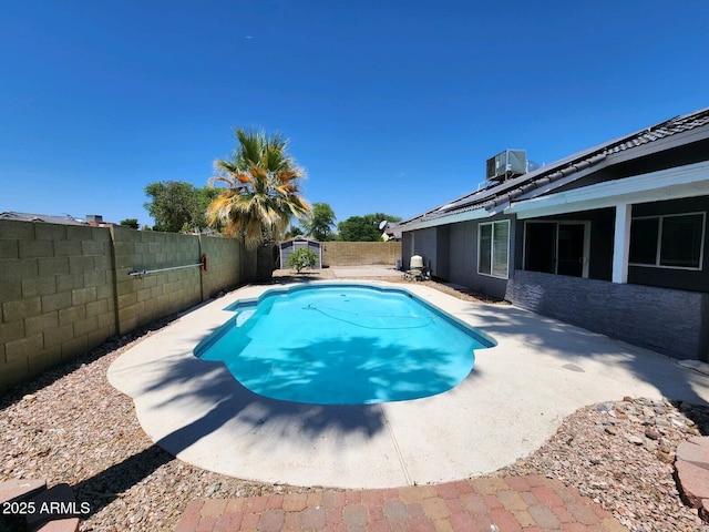 view of swimming pool featuring central AC unit