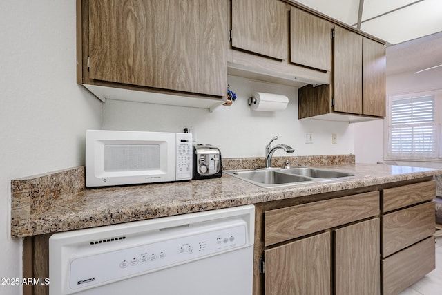 kitchen with sink and white appliances