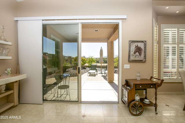 entryway with light tile patterned floors