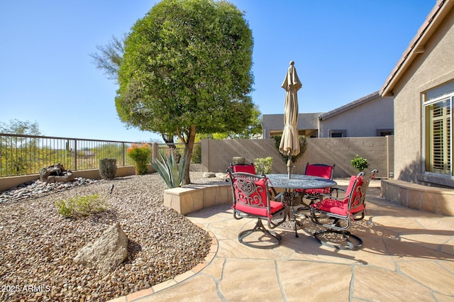 view of patio / terrace featuring an outdoor fireplace