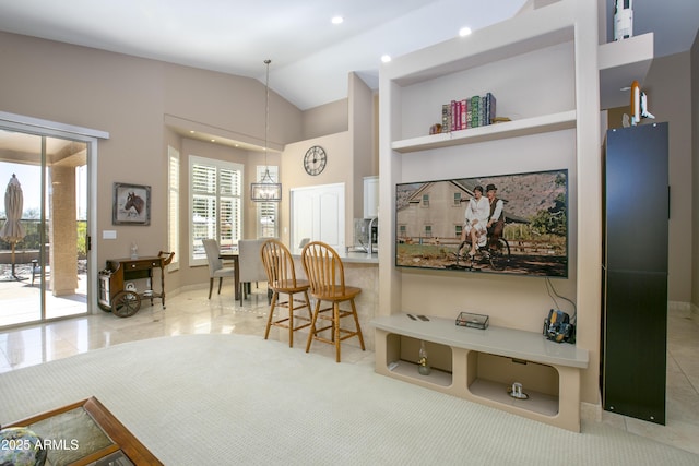 interior space with tile patterned flooring and vaulted ceiling