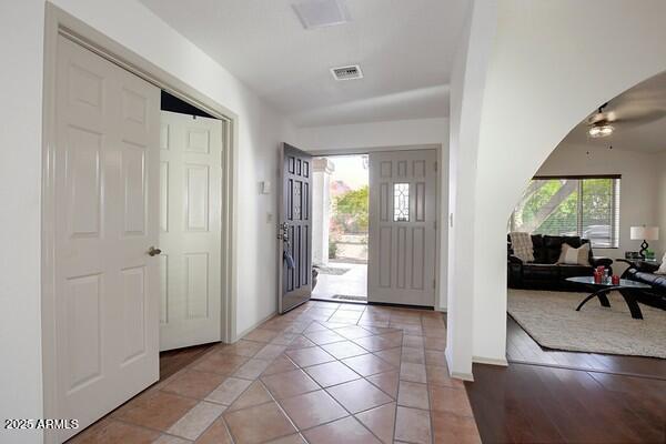 foyer entrance with light tile patterned floors