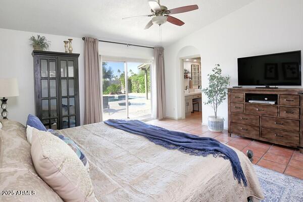 tiled bedroom featuring ceiling fan and access to exterior