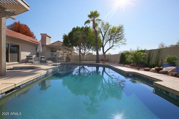 view of swimming pool with a patio