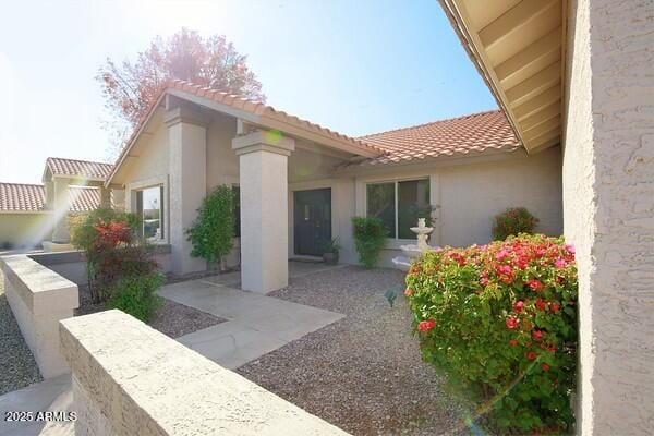 view of side of property with a patio