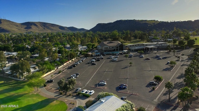 birds eye view of property with a mountain view