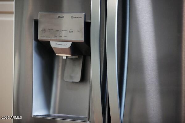 details with stainless steel fridge with ice dispenser