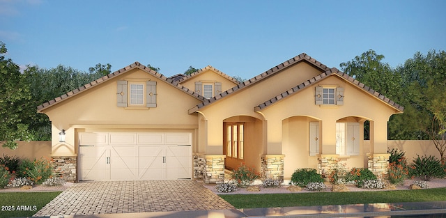 2508 E Preston St, Mesa, AZ 85213 - mediterranean / spanish home featuring decorative driveway, stucco siding, a tile roof, and stone siding
