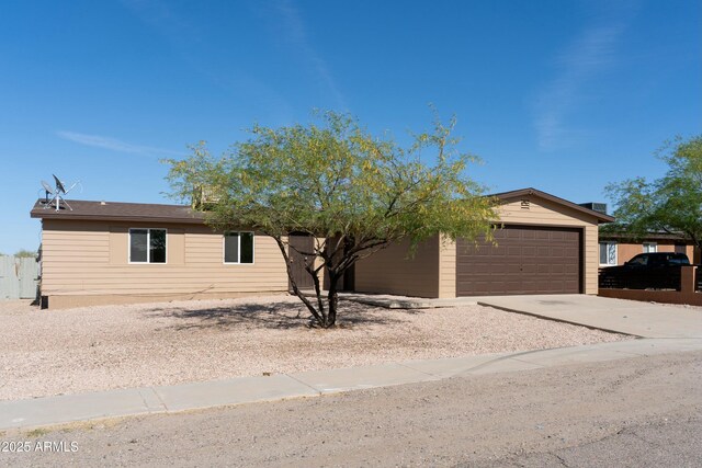 view of front of house with an attached garage and concrete driveway